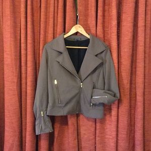 Asymmetric jacket with gold zippers